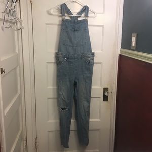 Distressed denim overalls